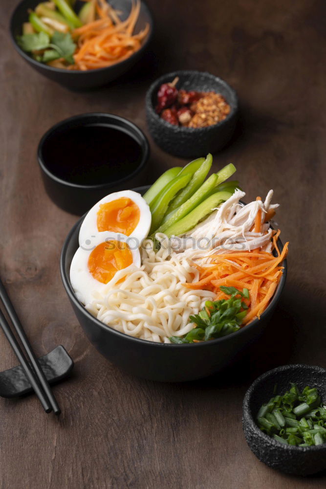 Similar – Geometric bowl of Asian Noodle Soup with chopsticks