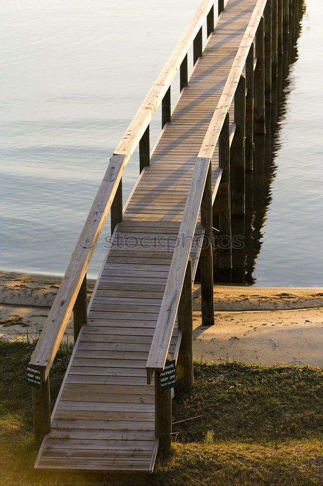 Similar – Image, Stock Photo Wooden bridge on the sea coast