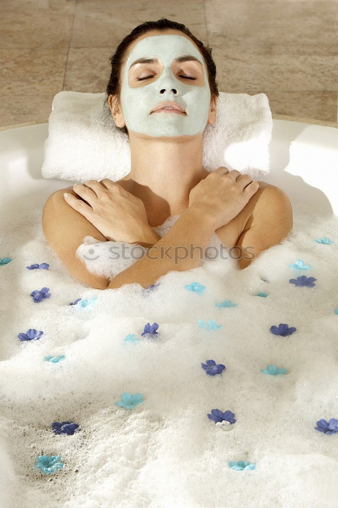 Similar – Image, Stock Photo Woman lying in tub doing hydrotherapy treatment