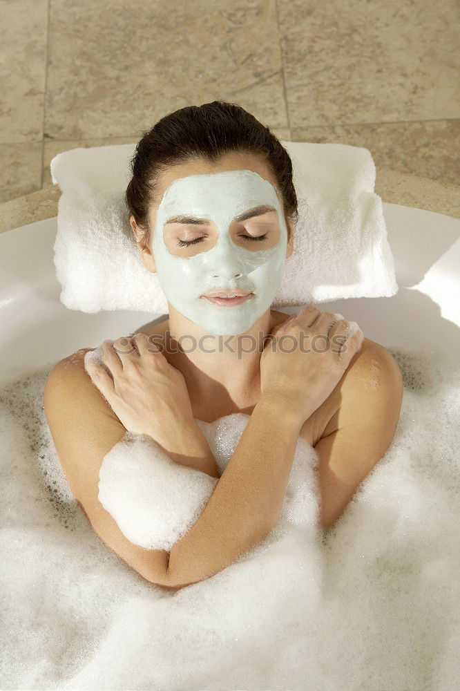 Image, Stock Photo Woman lying in tub doing hydrotherapy treatment