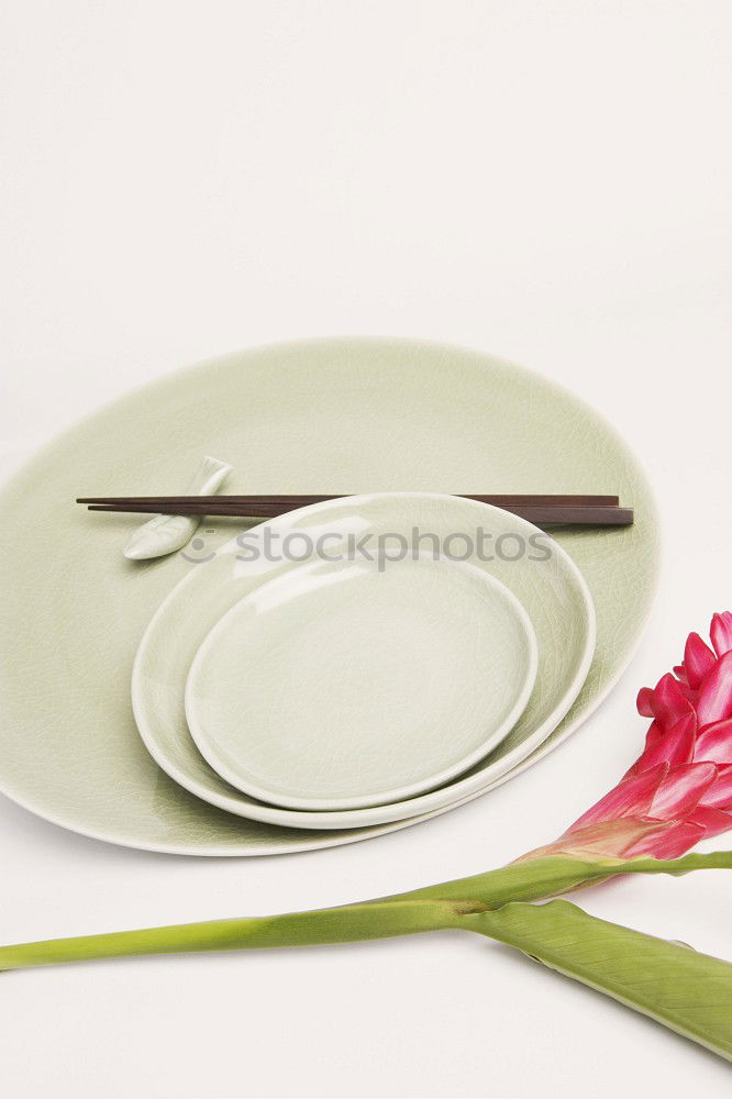 Similar – plate with a fork and knife on a brown wooden surface