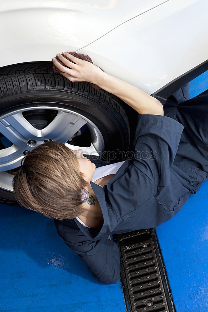 Professional Mechanic Repairing Car.