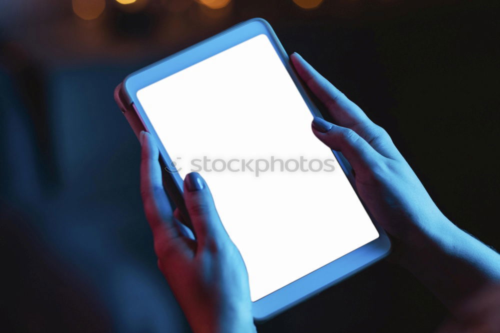 Similar – Image, Stock Photo Young people using tablet computer at home. They looking at pictures standing by the window in the evening. City lights outdoor