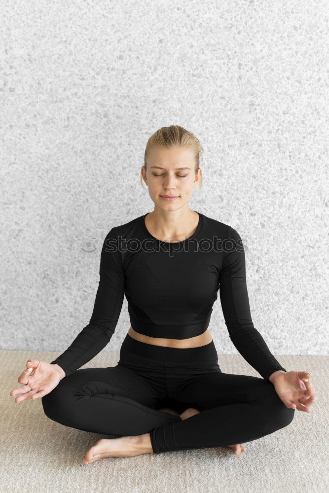 Similar – Woman sitting with one leg on chair