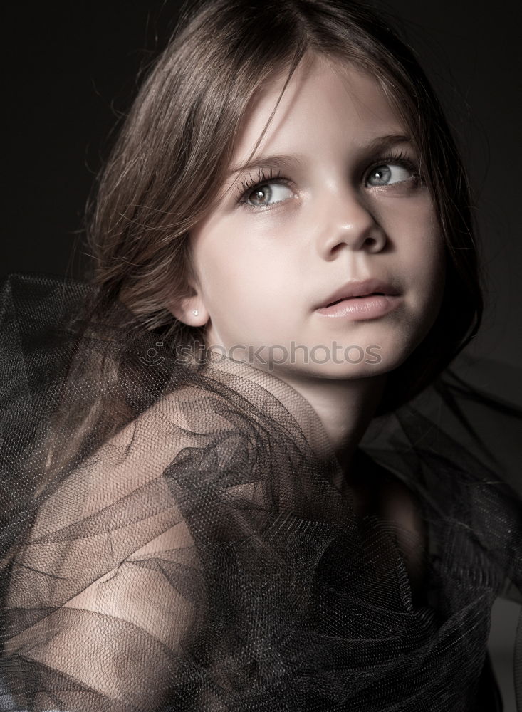 Similar – Image, Stock Photo Young woman with a cross covering her mouth