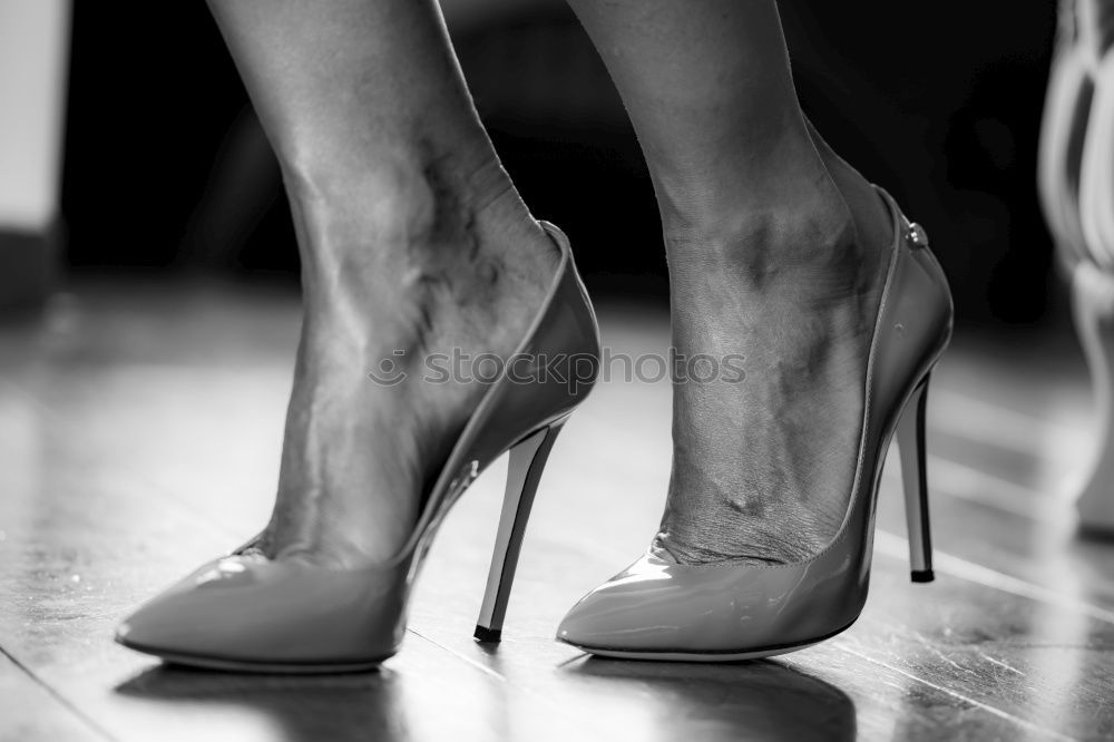 Similar – Ballerinas legs in black pointes on wooden floor in point position