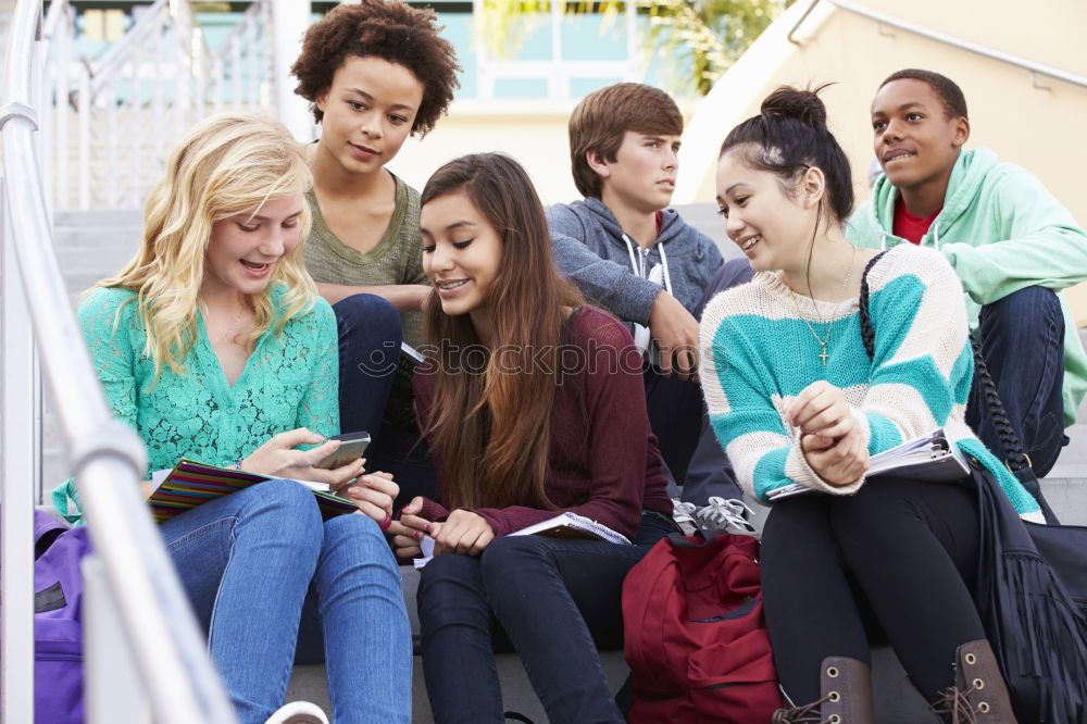 Similar – Multi-ethnic group of young people using smartphone