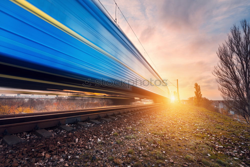 Image, Stock Photo High-speed train moving through nature at sunset
