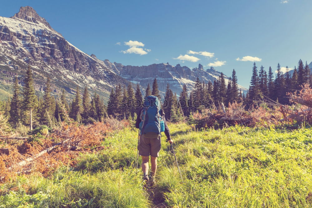 Similar – Young woman crossing the Alps