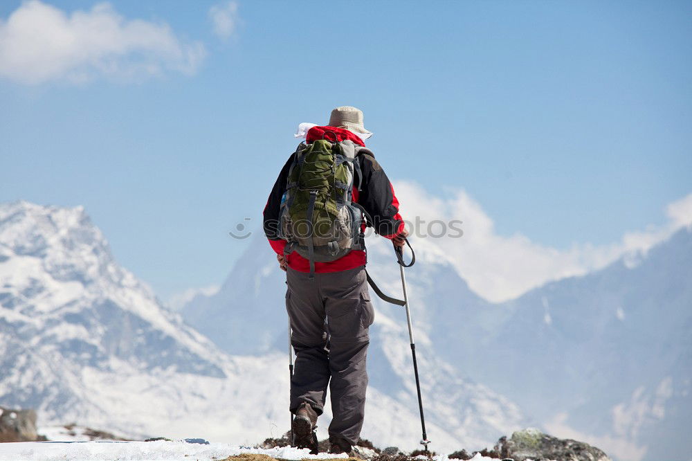 Similar – Image, Stock Photo Winter vacation: mountaineer takes a rest