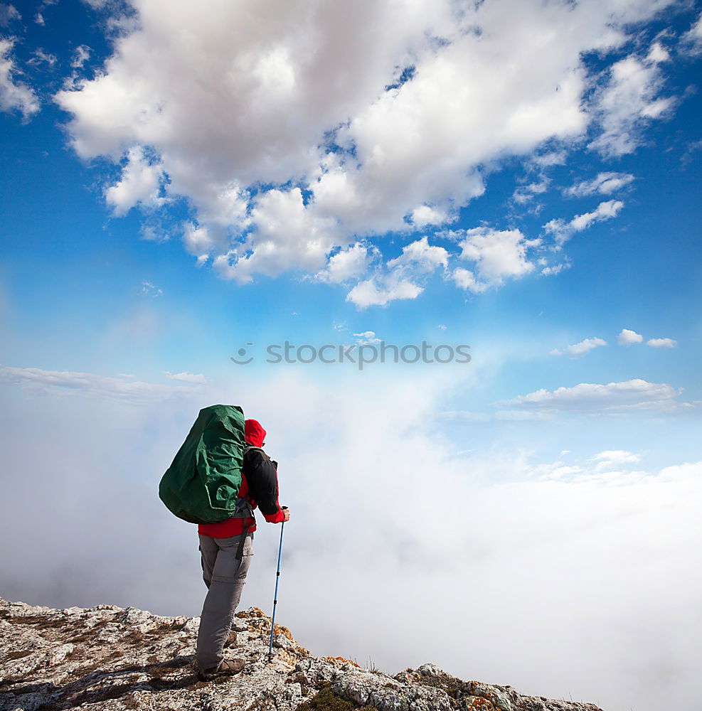 Similar – Male hiker standing on the top of a mountain.