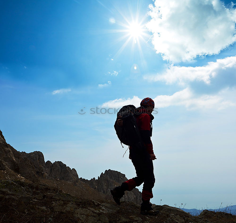 Similar – Male hiker standing on the top of a mountain.