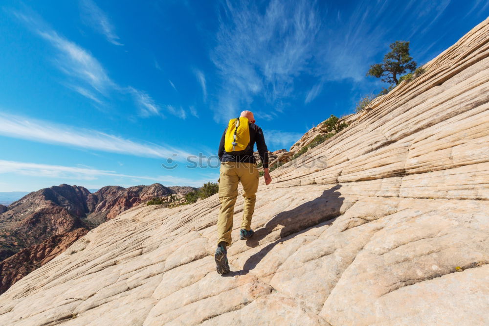 Similar – Image, Stock Photo Rock climber clinging to a cliff.