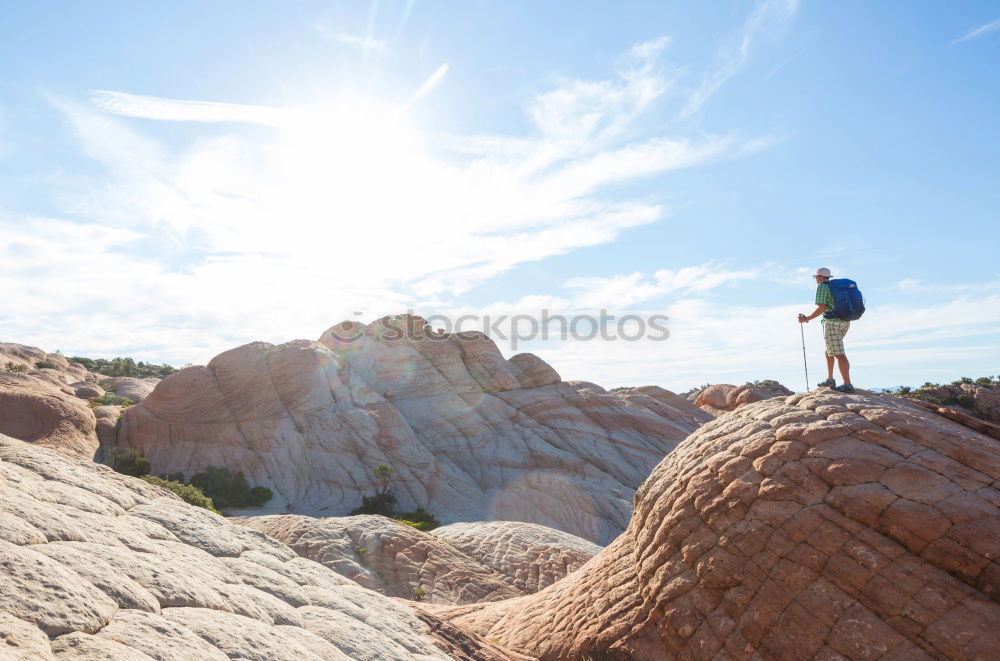 Similar – Man sitting on cliff