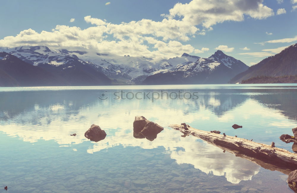 Similar – Image, Stock Photo Wooden footbridge at Silsersee with mountains in the background