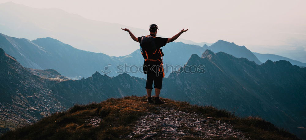 Similar – Man admiring view on cliff