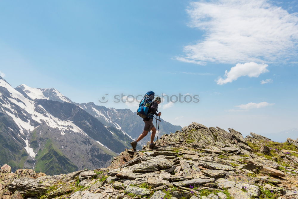 Similar – Image, Stock Photo Climbing sport: young boy takes a rest observing panorama