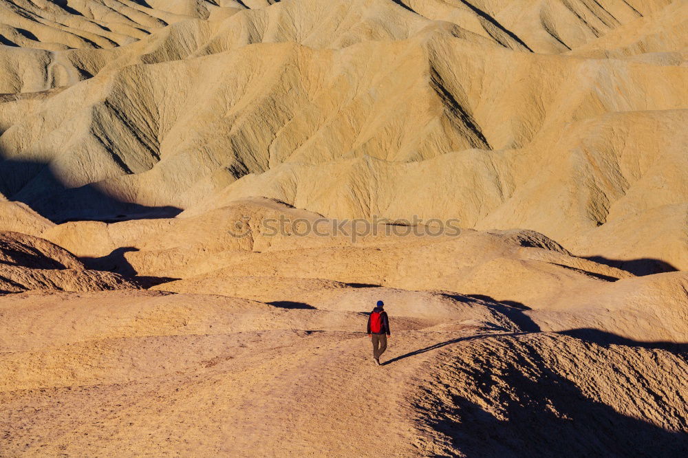 Similar – Hiker in the desert.