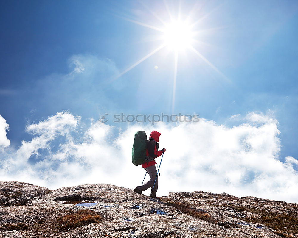 Similar – Male hiker standing on the top of a mountain.