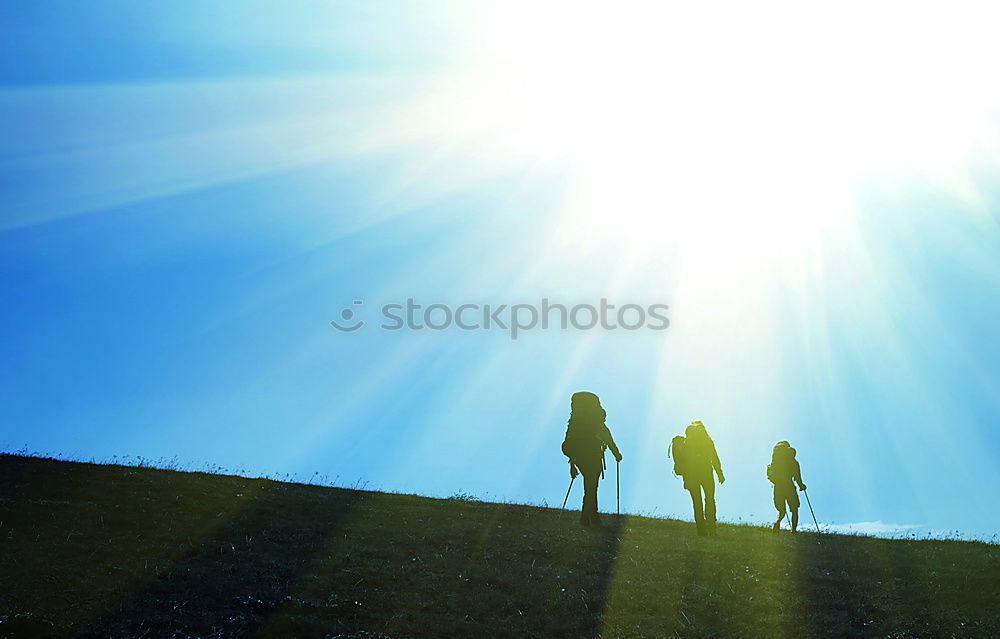 Similar – Image, Stock Photo Silhouette of hiking friends against sun