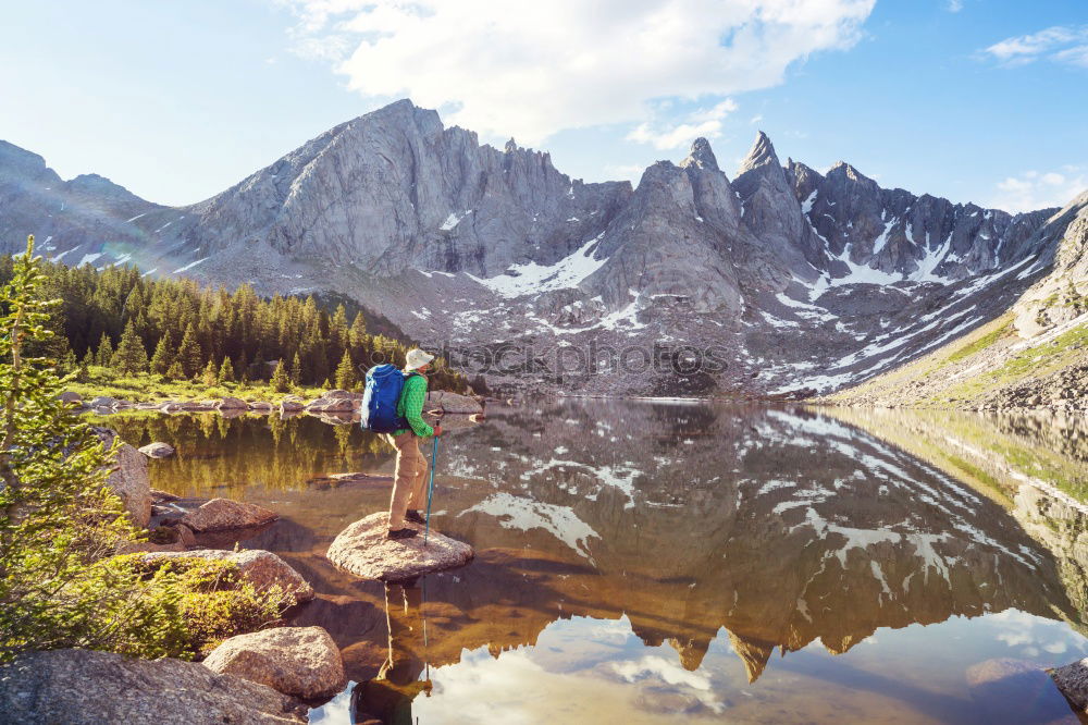 Woman refreshes herself while hiking