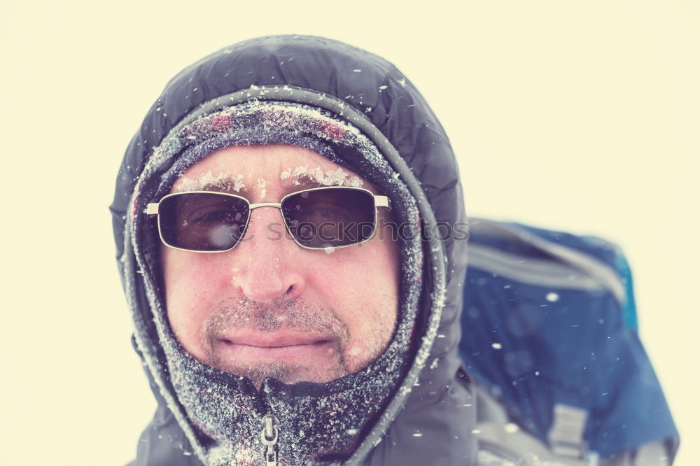 Similar – Happy man with a mustache in a knitted winter cap and warm winter clothing