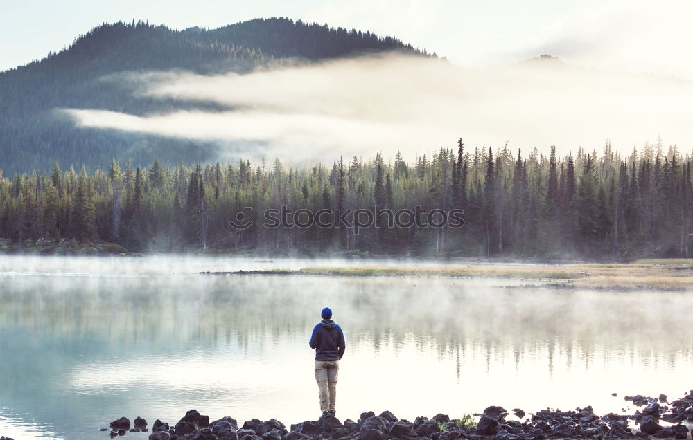 Similar – Image, Stock Photo Young tourist with backpack looks through a binoculars