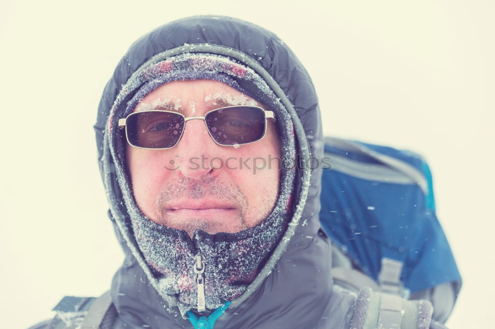 Similar – Happy man with a mustache in a knitted winter cap and warm winter clothing