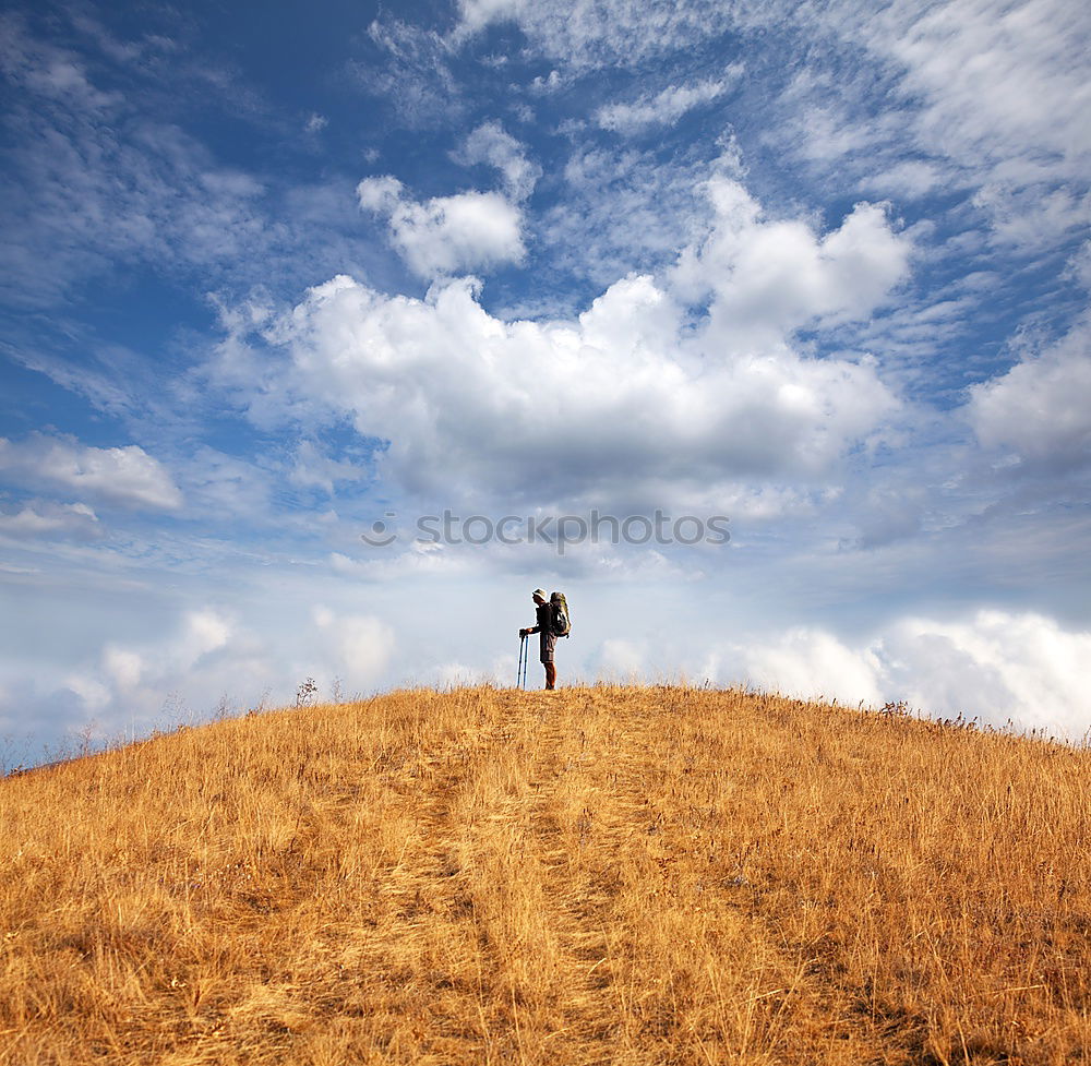 Similar – Couple sitting on a mountain with wide horizon