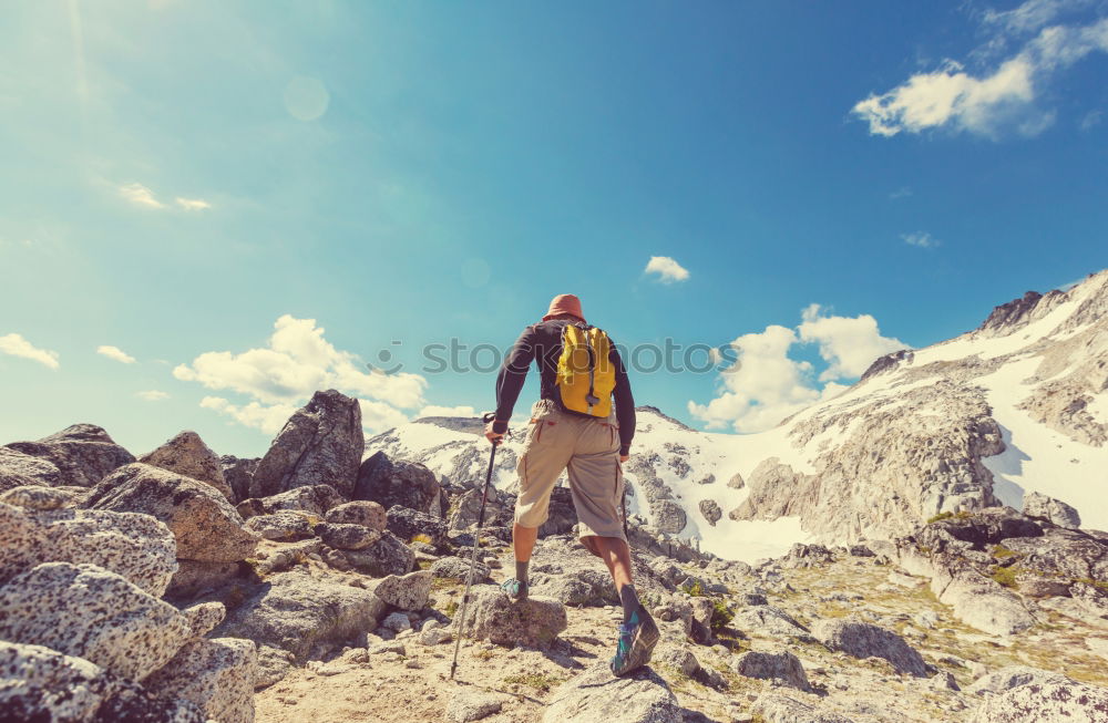 Similar – Image, Stock Photo Boy resting on a rock in the mountains