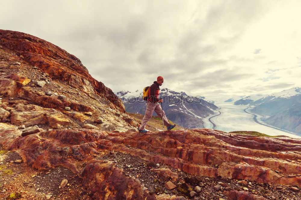 Similar – A photographer takes a picture of the view on Isle of Skye II