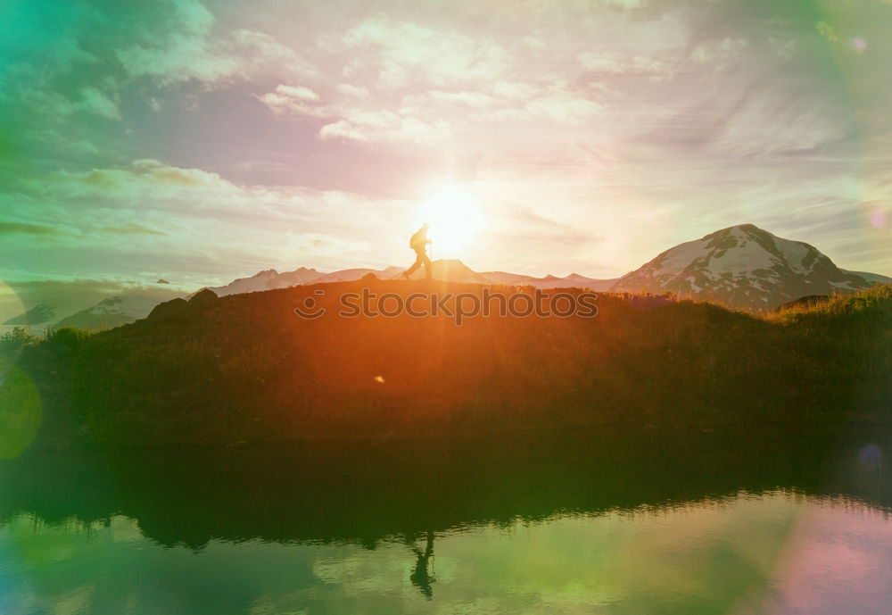 Similar – Image, Stock Photo The silhouette of man sitting alone at the beach