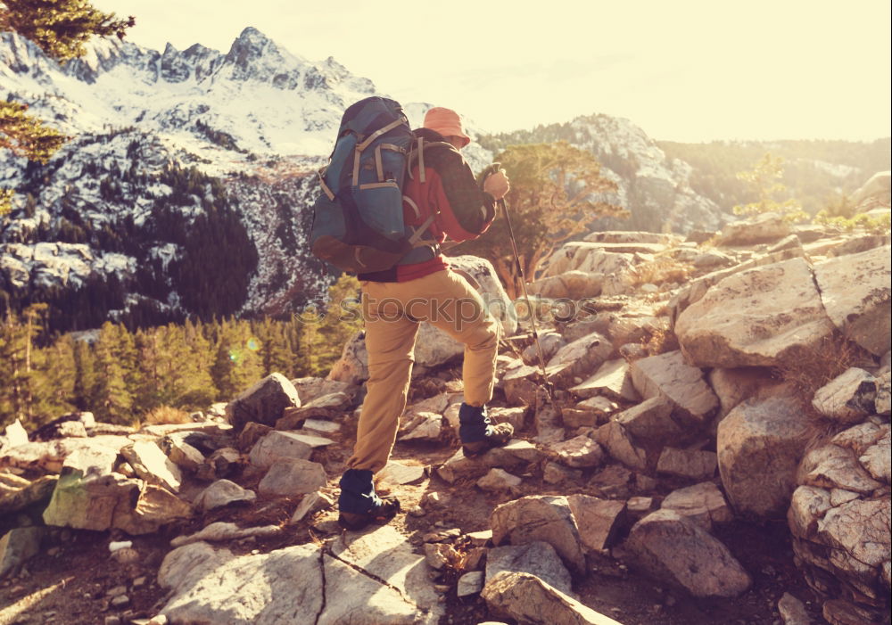 Similar – Image, Stock Photo Young climbers putting climbing shoes on