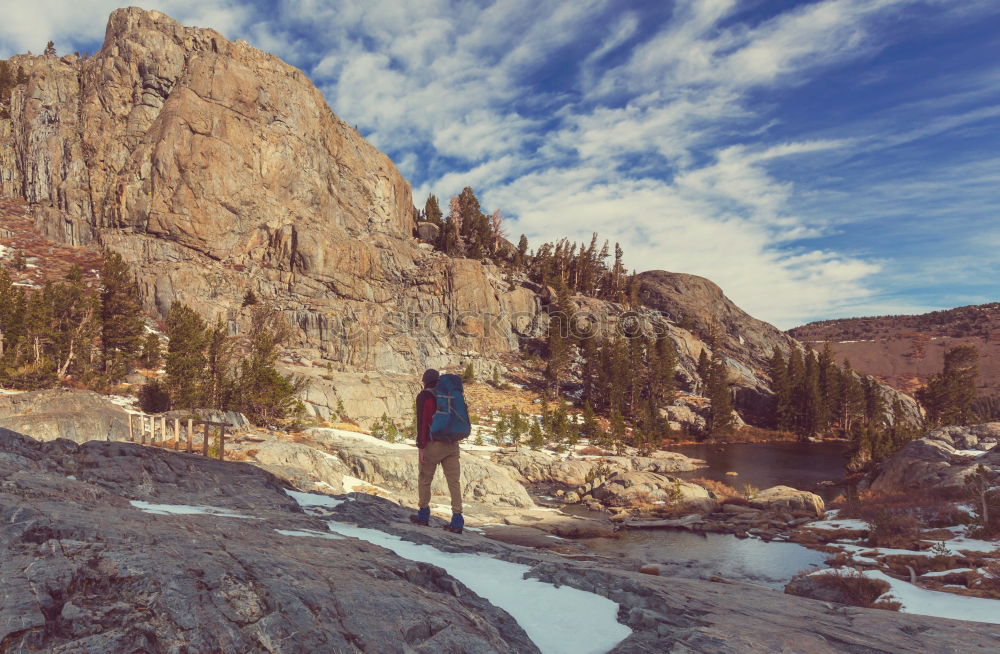 Woman walks and looks into the mountains