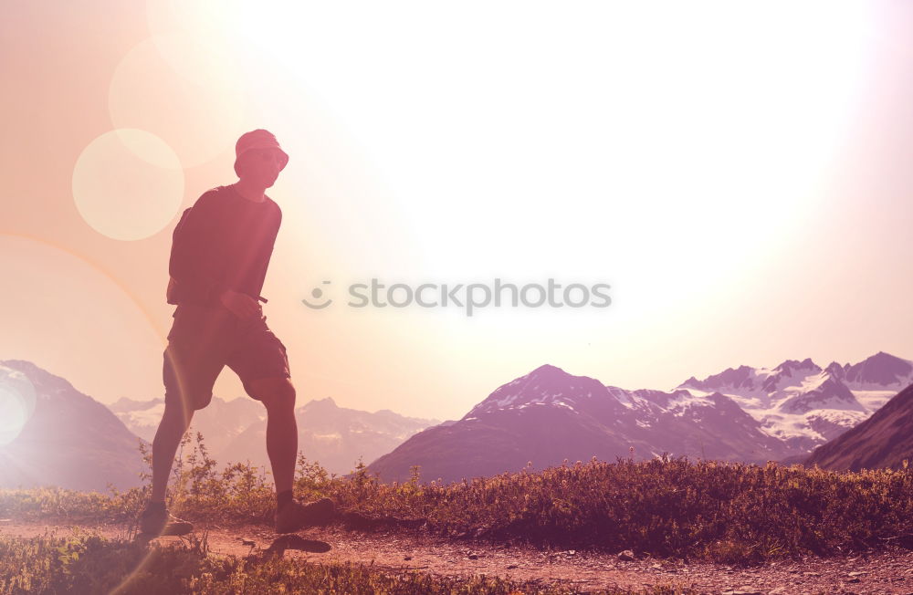 Similar – Tourist standing on cliff in sunny day