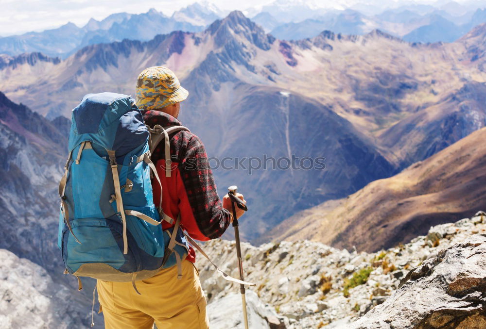 Similar – Hikers with rucksack in the mountains