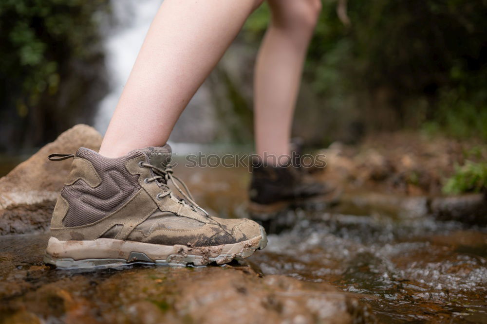 Similar – Image, Stock Photo Legs in leather boots in puddle