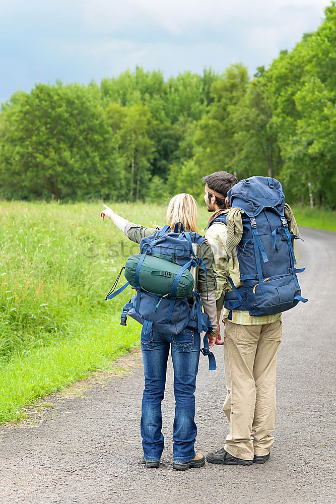 Similar – Image, Stock Photo Couple of hikers doing trekking