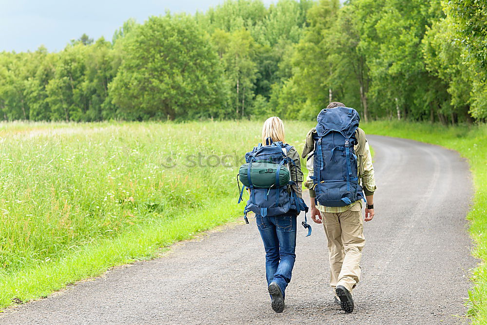 Similar – Image, Stock Photo Couple of hikers doing trekking