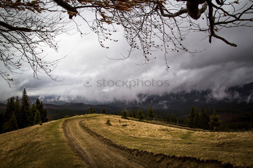 Similar – Thundery, mountain landscape with storm clouds