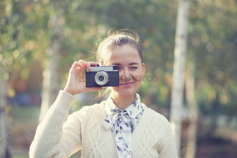 Close up of a photographer with her camera.