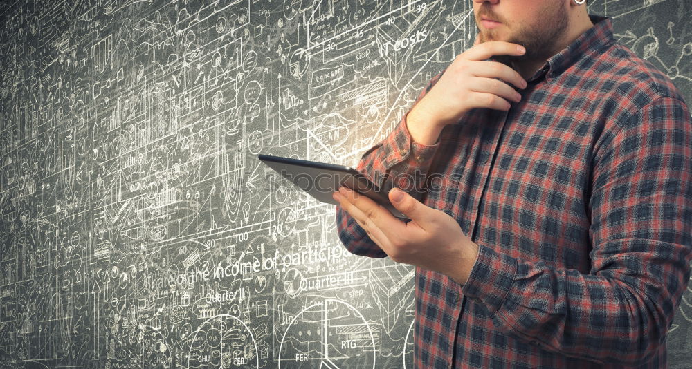 Similar – Young man writing in notebook