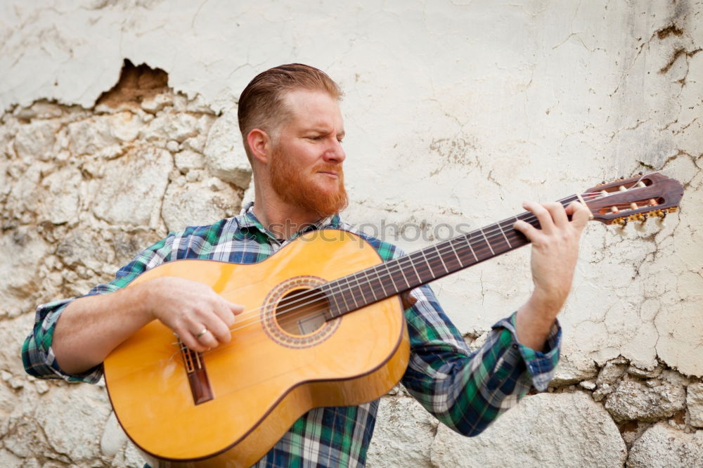 Similar – outdoor photo session with a bass player and his instruments