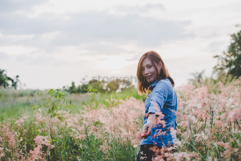 Similar – Happy young black woman surrounded by flowers