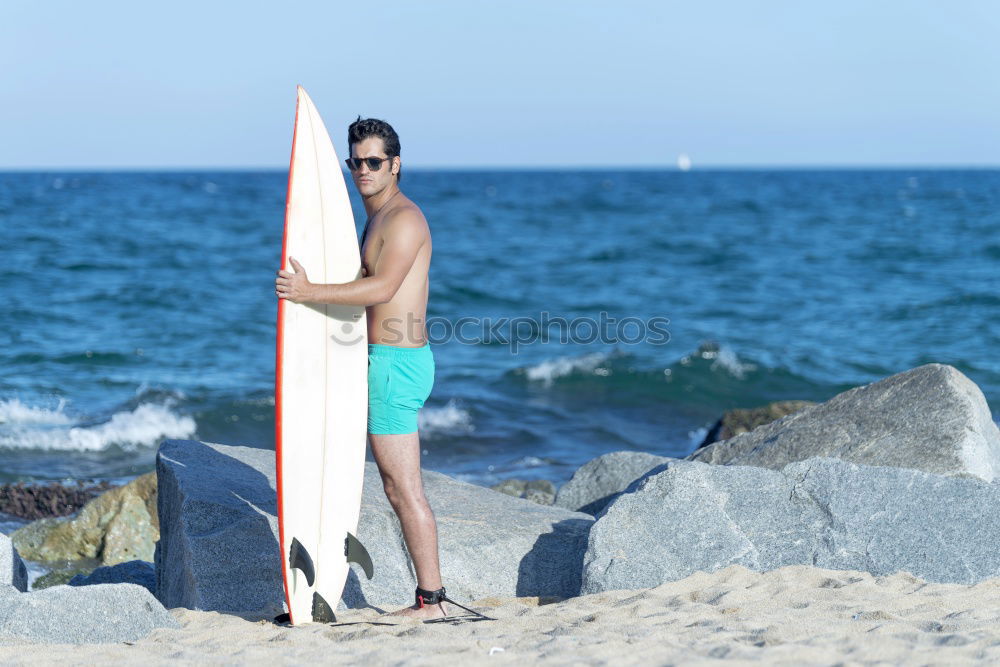 Similar – A young woman sitting under a surfboard