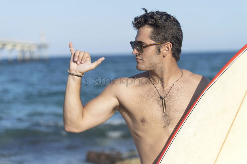 Similar – Young attractive surfer holding his surfboard at the beach