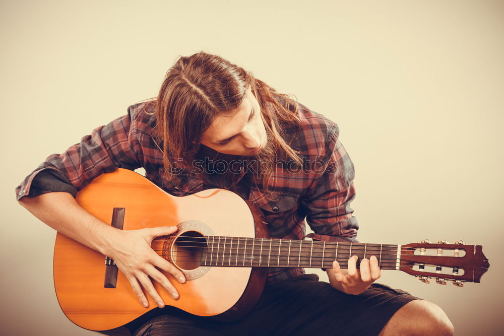 Similar – Foto Bild Eine Frau spielt barfuß Gitarre