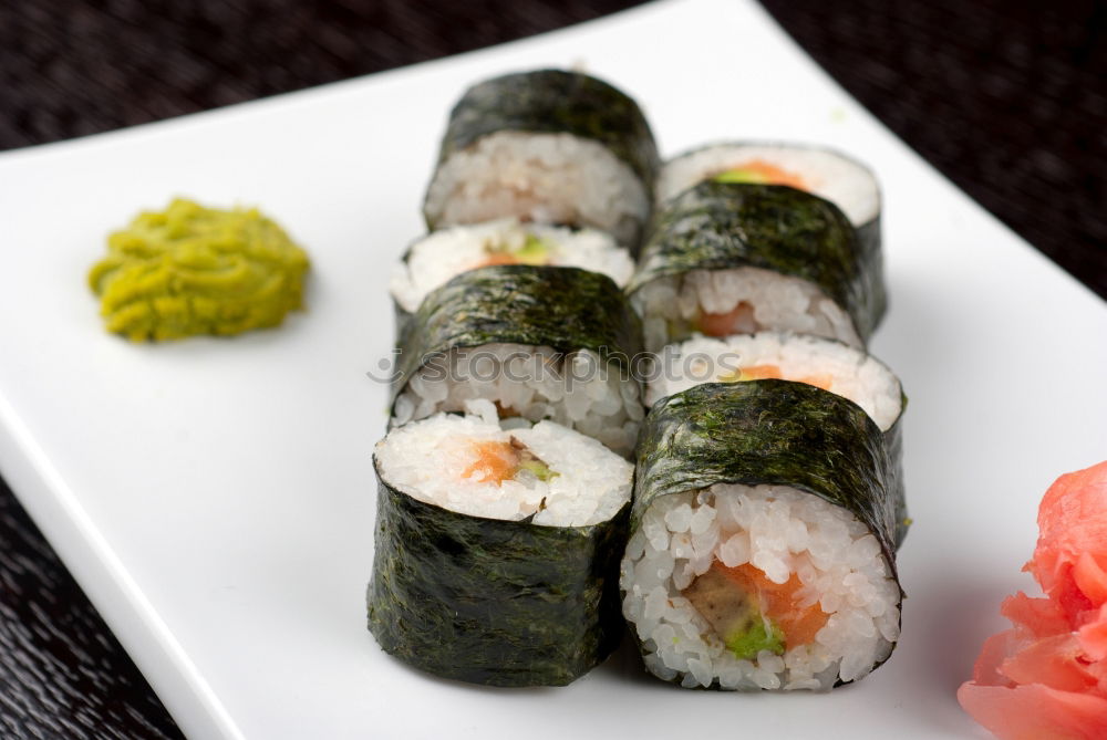 sushi assortment in white plate and soya sauce