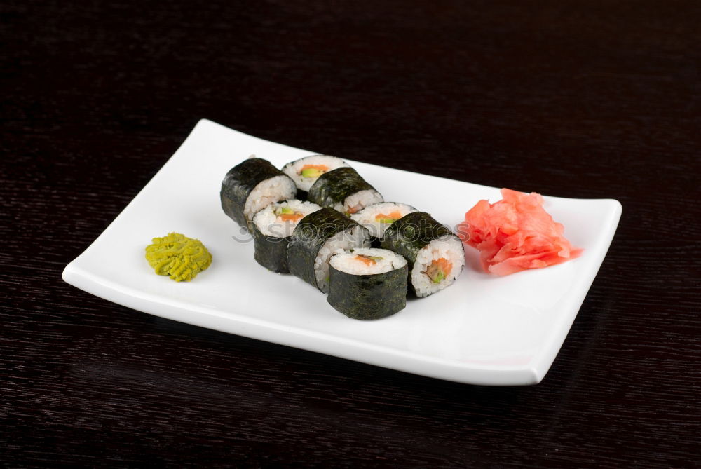 Similar – sushi assortment in white plate on black background