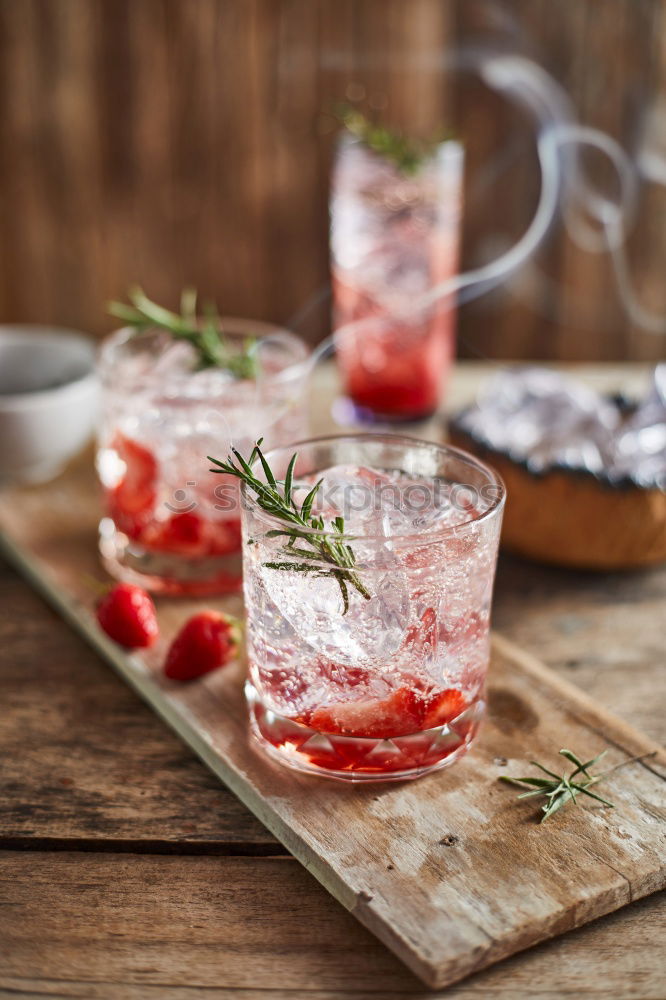 Similar – Image, Stock Photo Watermelon with rosemary and ice cream sticks as a refreshing drink on a silver tray